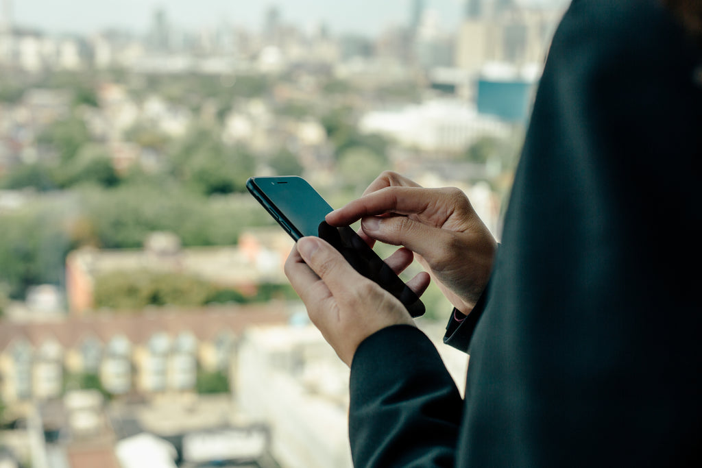 using-smartphone-with-city-in-the-background